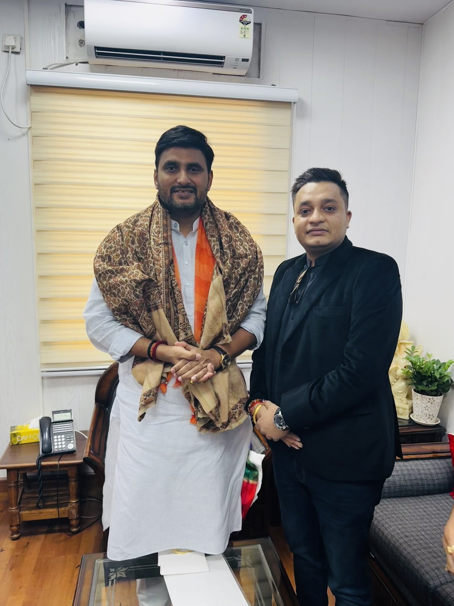 Nitish Jindal with BJP leader Neeraj Singh during an informal meeting at his residence