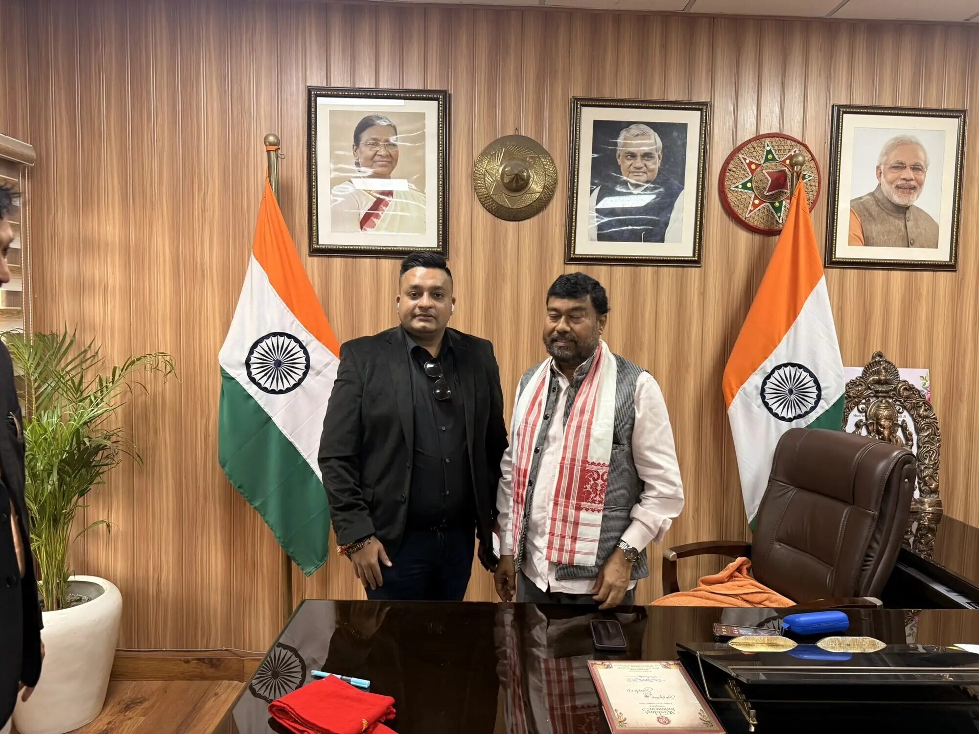Nitish Jindal with Shri Rameswar Teli in an official office